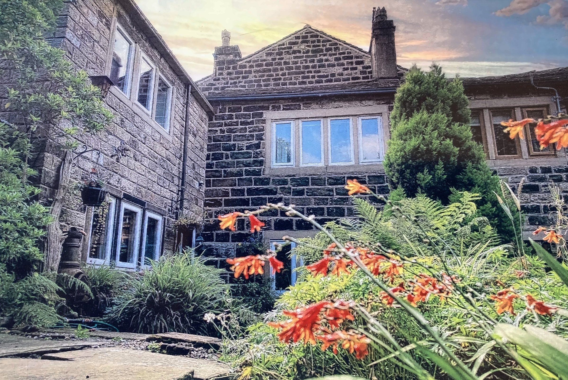Pots & Pans Cottage, a stone weaver’s cottage in Uppermill, seen from the garden